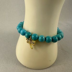 Handcrafted Turquoise bead stretch bracelet with silver tone dragonfly charm